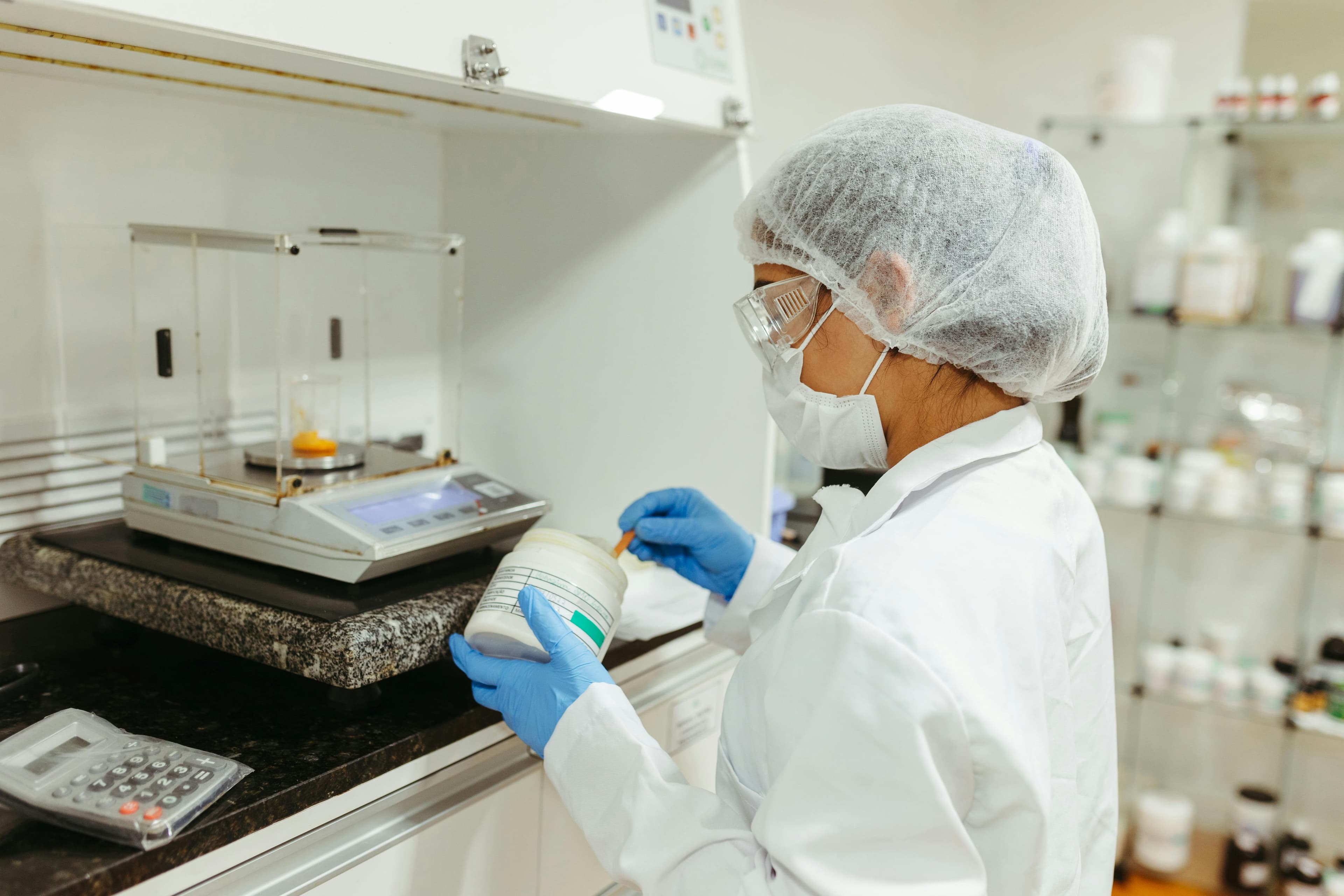 Pharmacist preparing a custom compounded medication at The Chemist Pharmacy