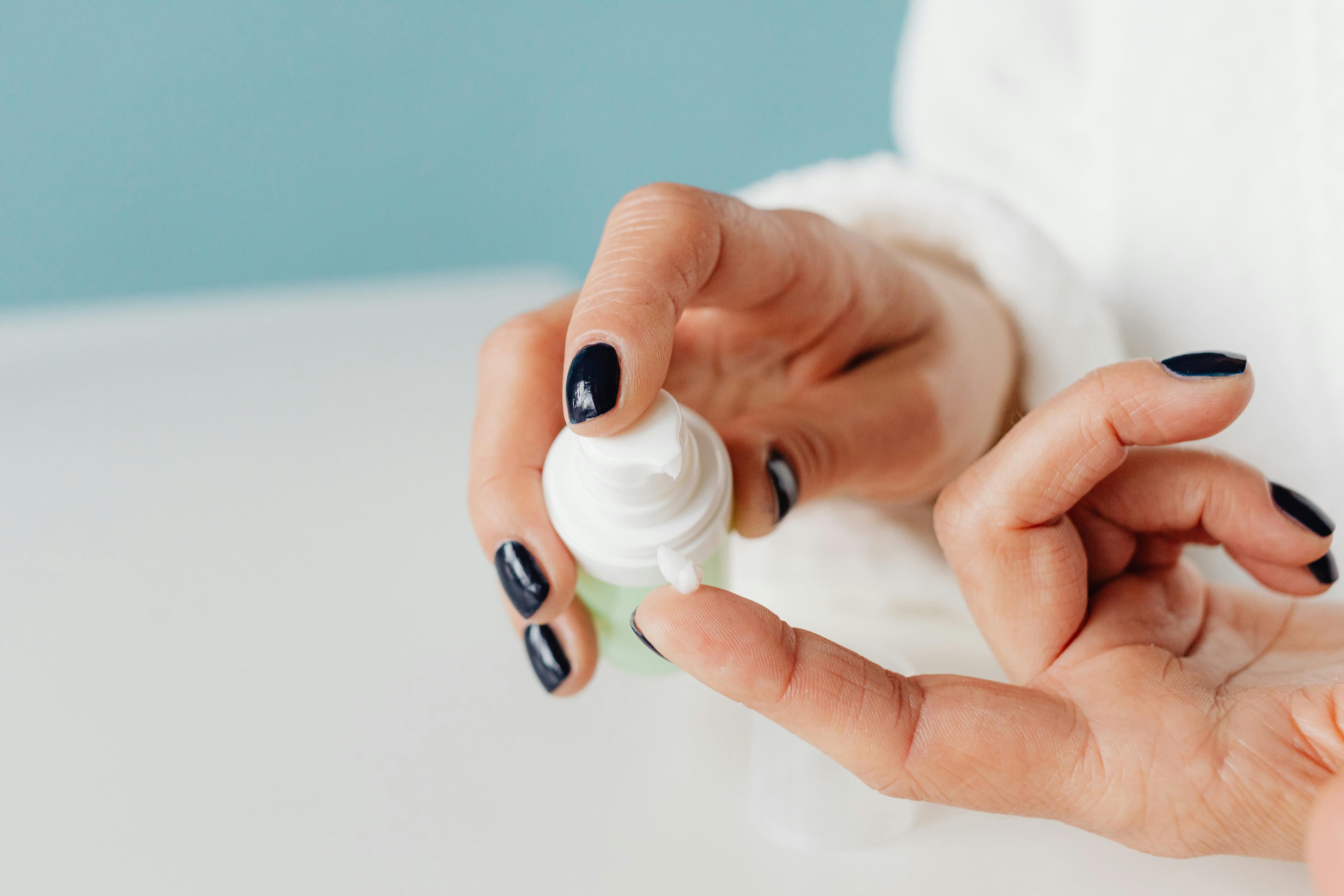 Hands dispensing custom compounded cream